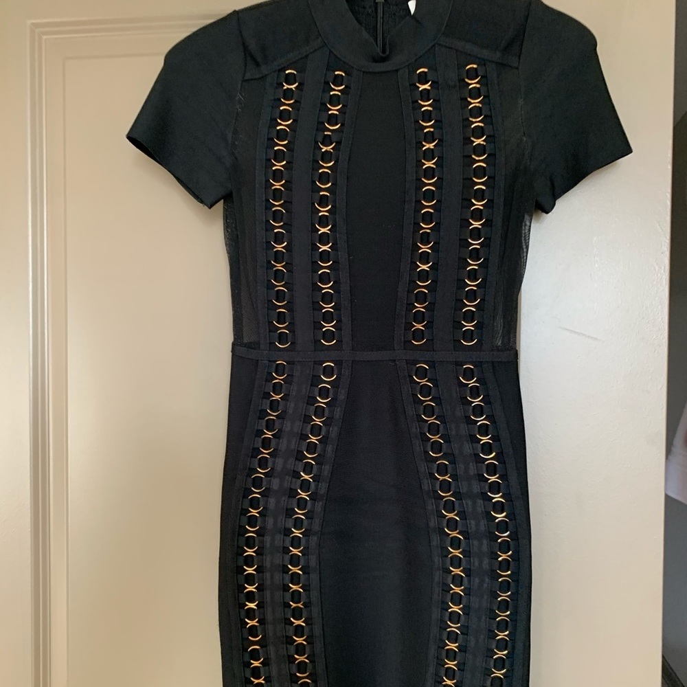 Black fitted dress with gold links